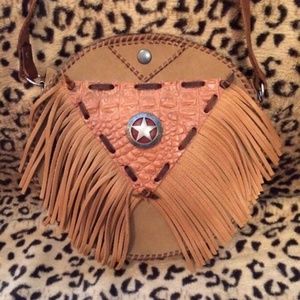 Handmade leather shoulder, clutch, and across body